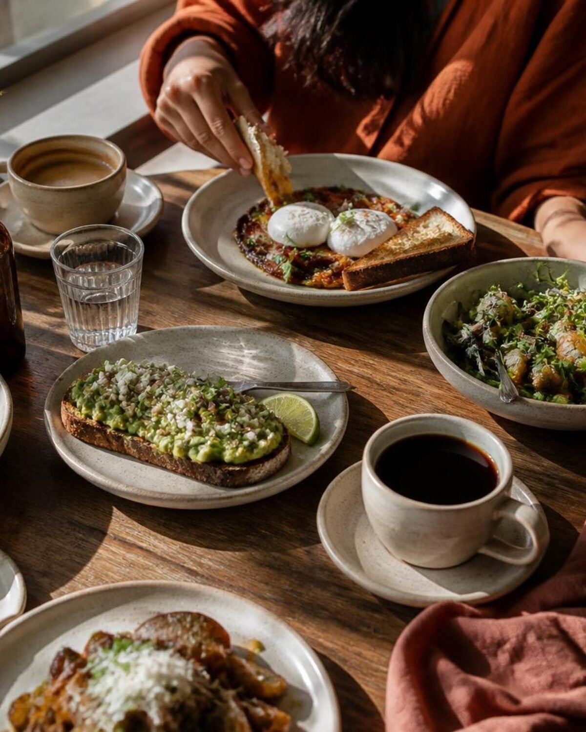 A generous brunch table set in warm morning light